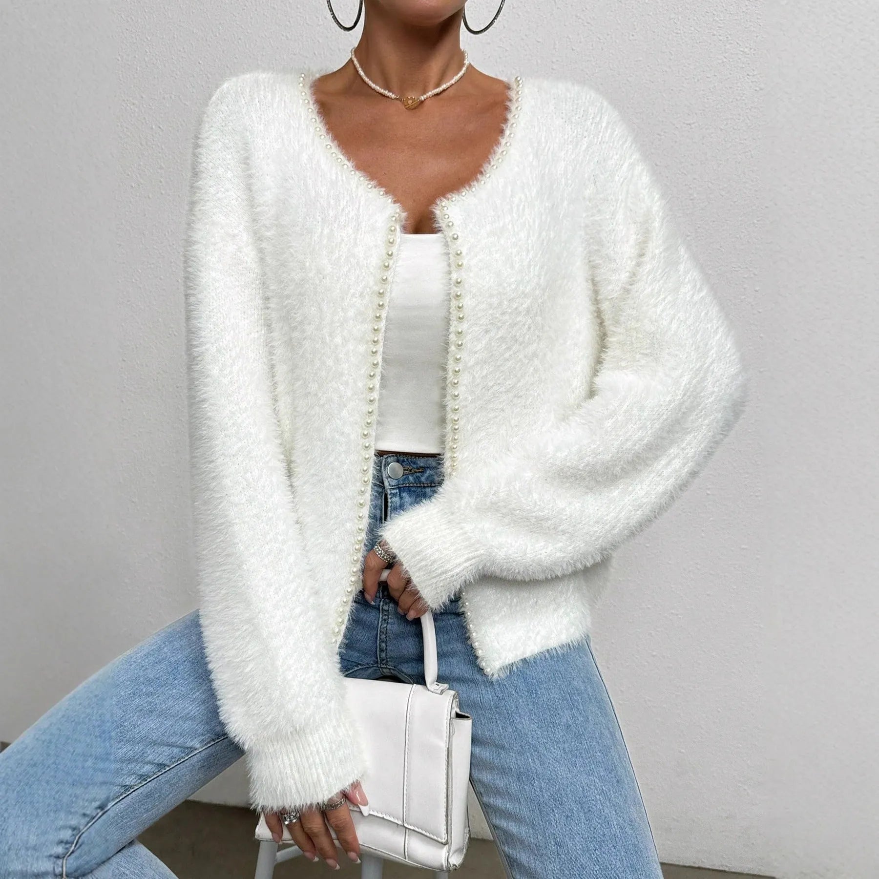 White women's V-neck cardigan sweater with medium thickness and standard length