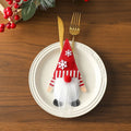 Christmas knife and fork cloth cover in snowflake style on a dining table