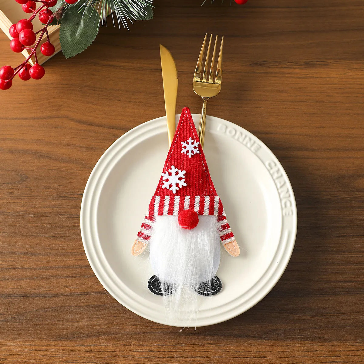 Christmas knife and fork cloth cover in snowflake style on a dining table