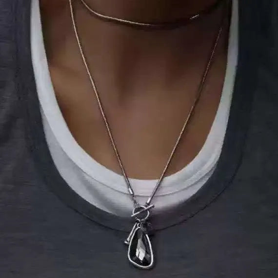 Long alloy snake bones chain necklace with a geometric plaid pendant for women