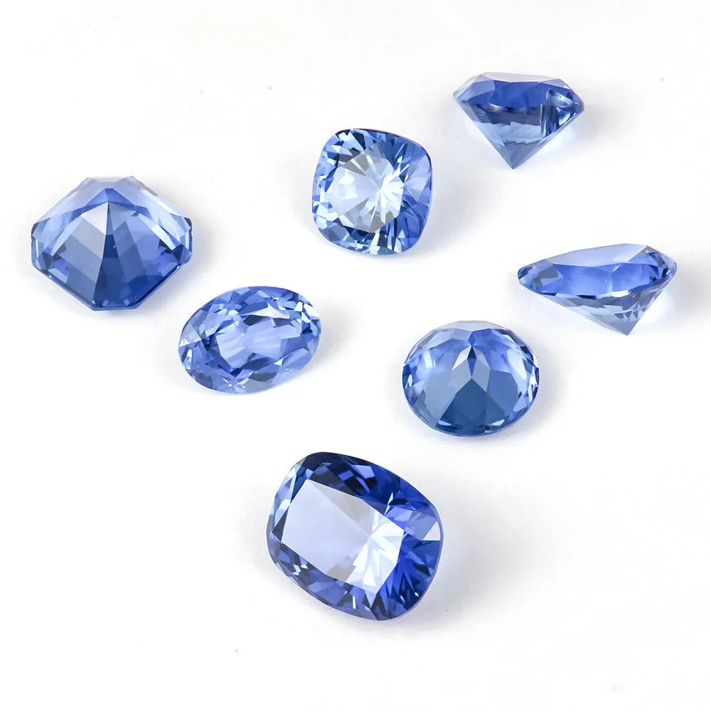 Royal blue loose gemstone in heart shape on a white background for jewellery making.