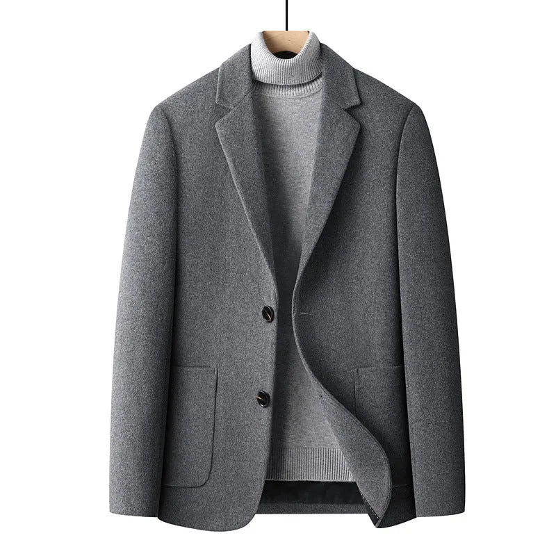 Men's slim fit wool suit jacket in a grey colour, showing the tailored silhouette and front button closure.