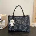 Women's canvas tote bag with printed rhombus pattern in black colour with pendant attachment