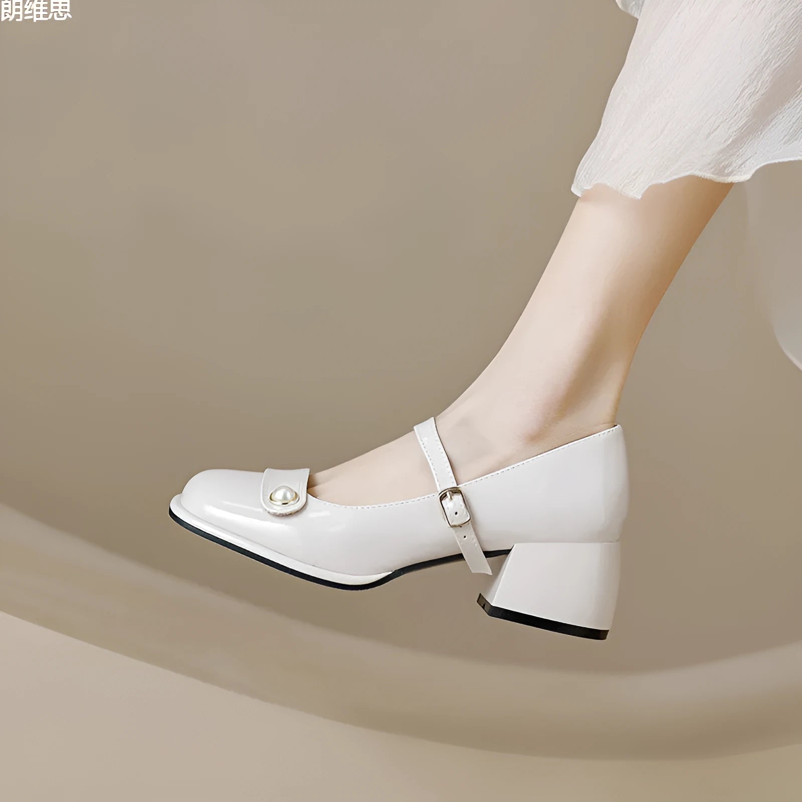 French style chunky heel ankle boots with patent leather upper, square toe, and buckle fastening