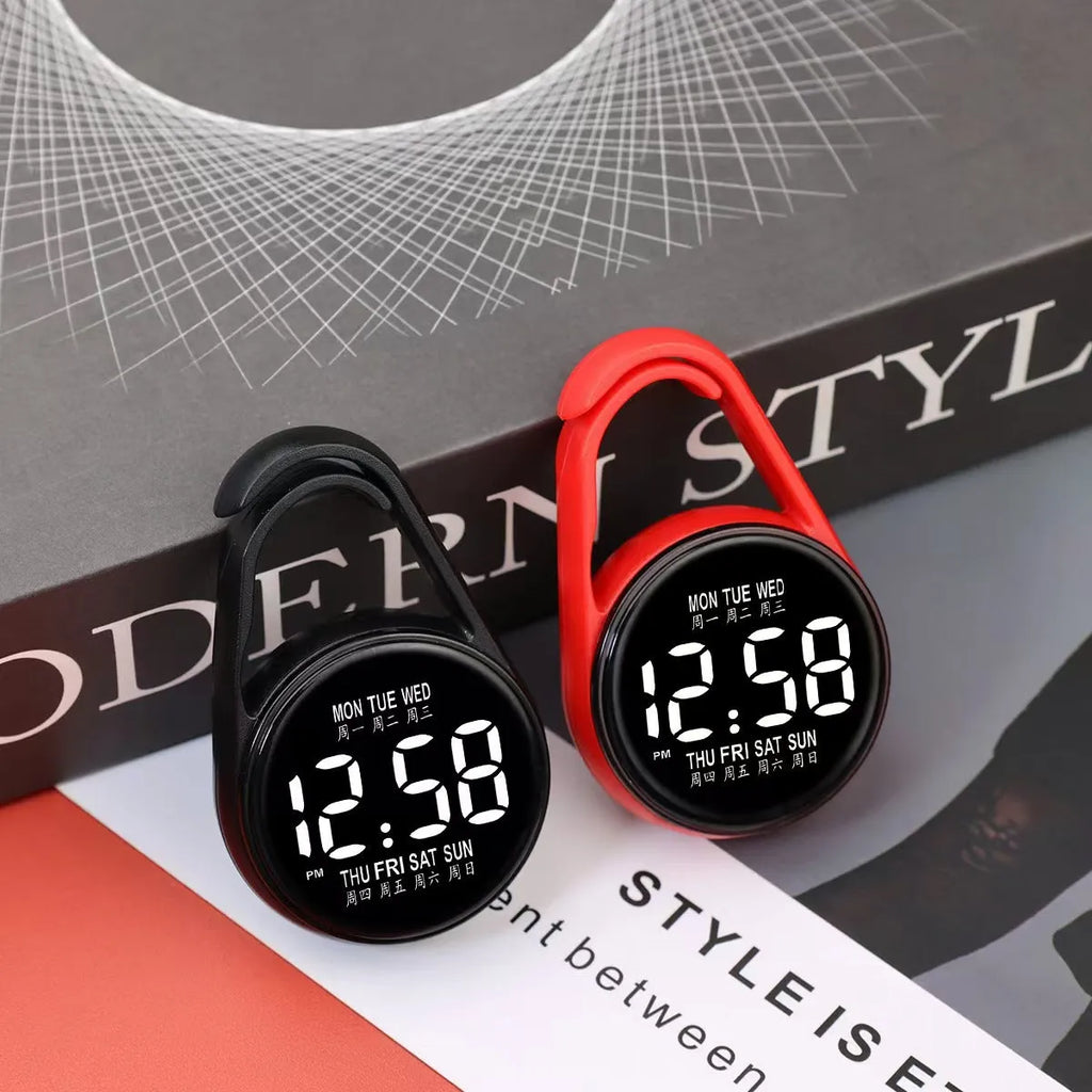 LED digital watch with luminous display and plastic strap in one of ten colour options on a wrist.