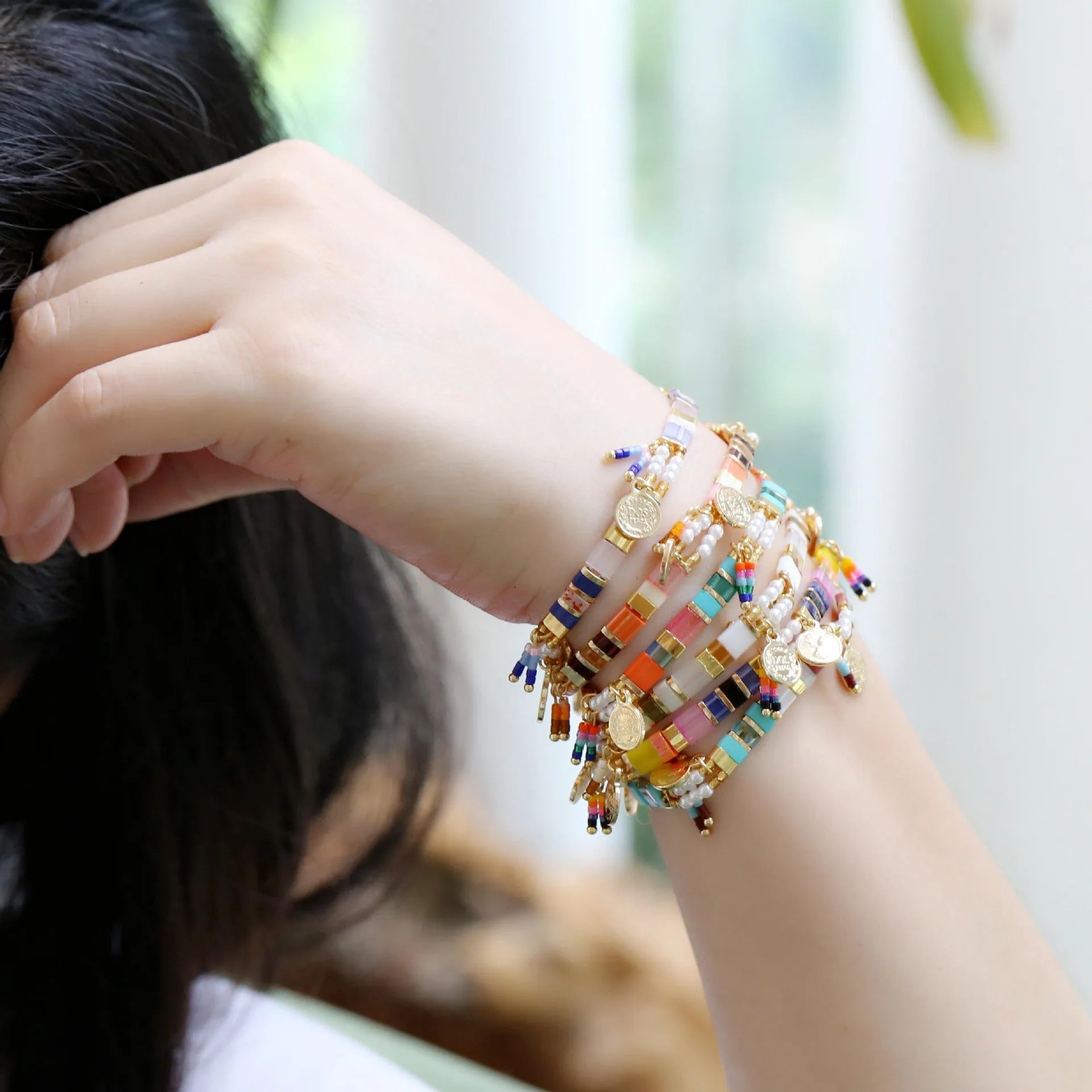Women's imitation pearl beaded bracelet with glass coloured detailing in pearl lift colour options