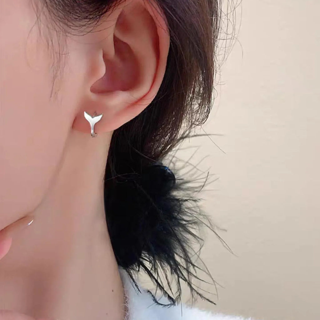 Women's fashion earrings with fishtail design in copper with gold colour finishes