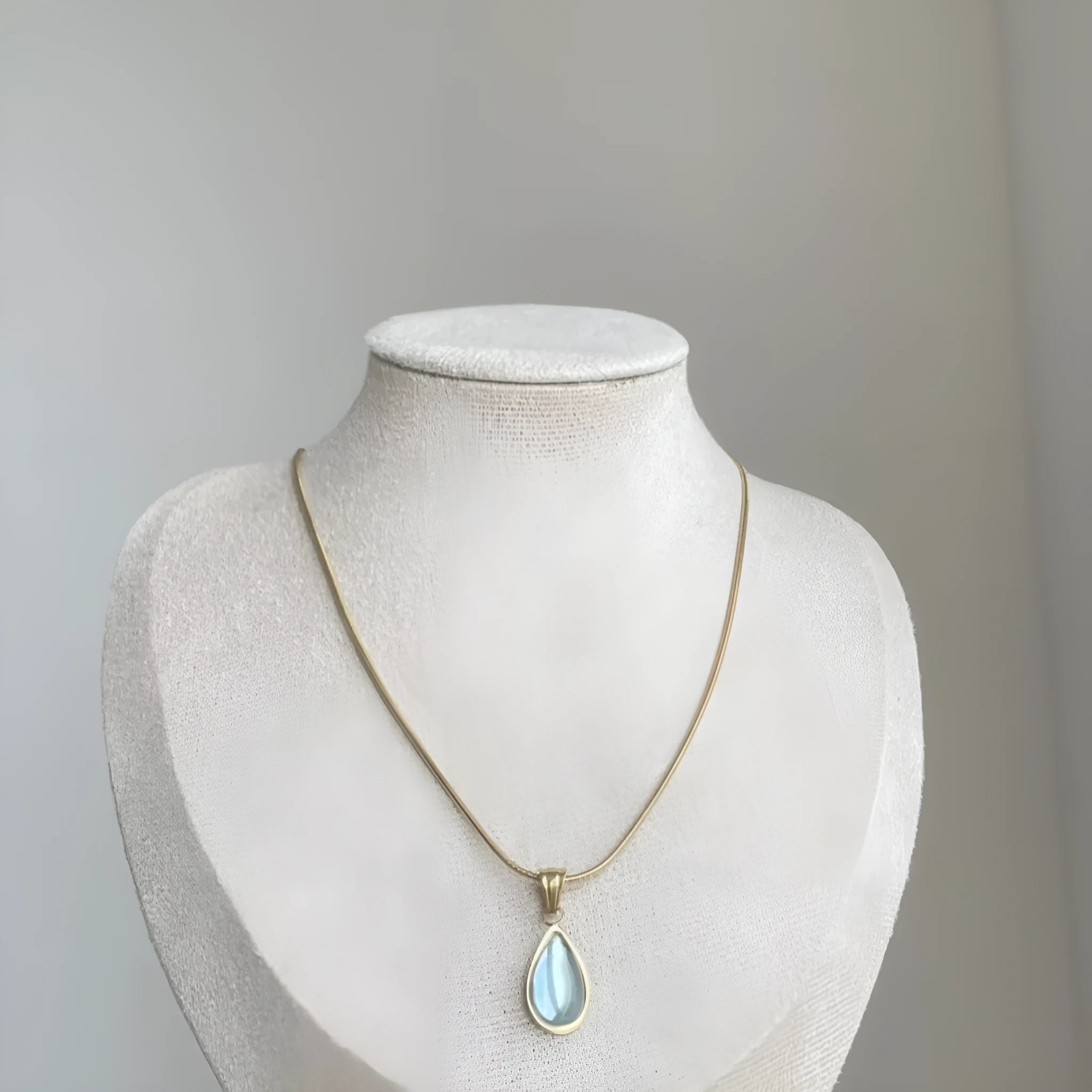 Retro blue and green water drop necklace with gem inlays on titanium steel snake bone chain