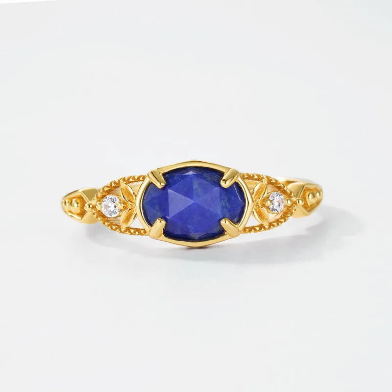 Japanese geometric silver ring with elliptical face and round lapis lazuli stone showing forest night sky colour