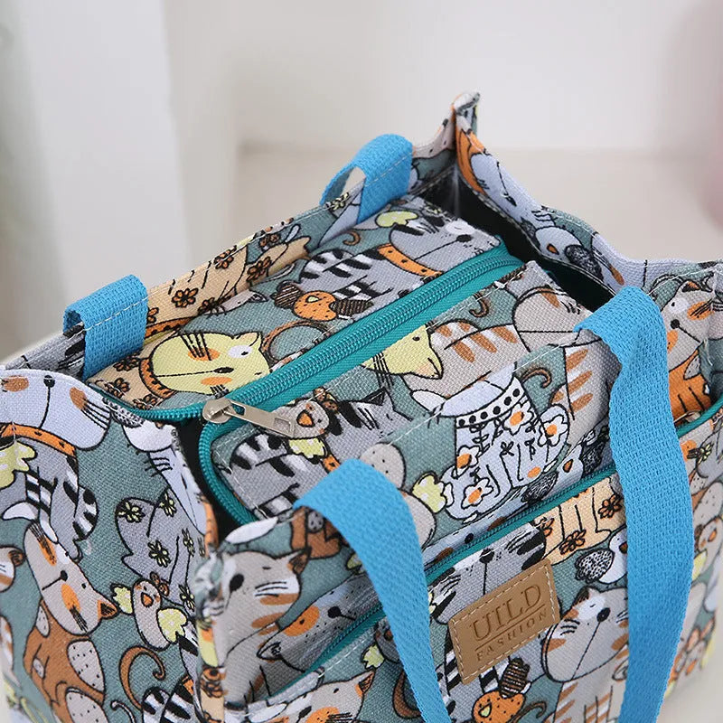 Women's square canvas handbag with aluminium frame in floral, cat and letter printed designs
