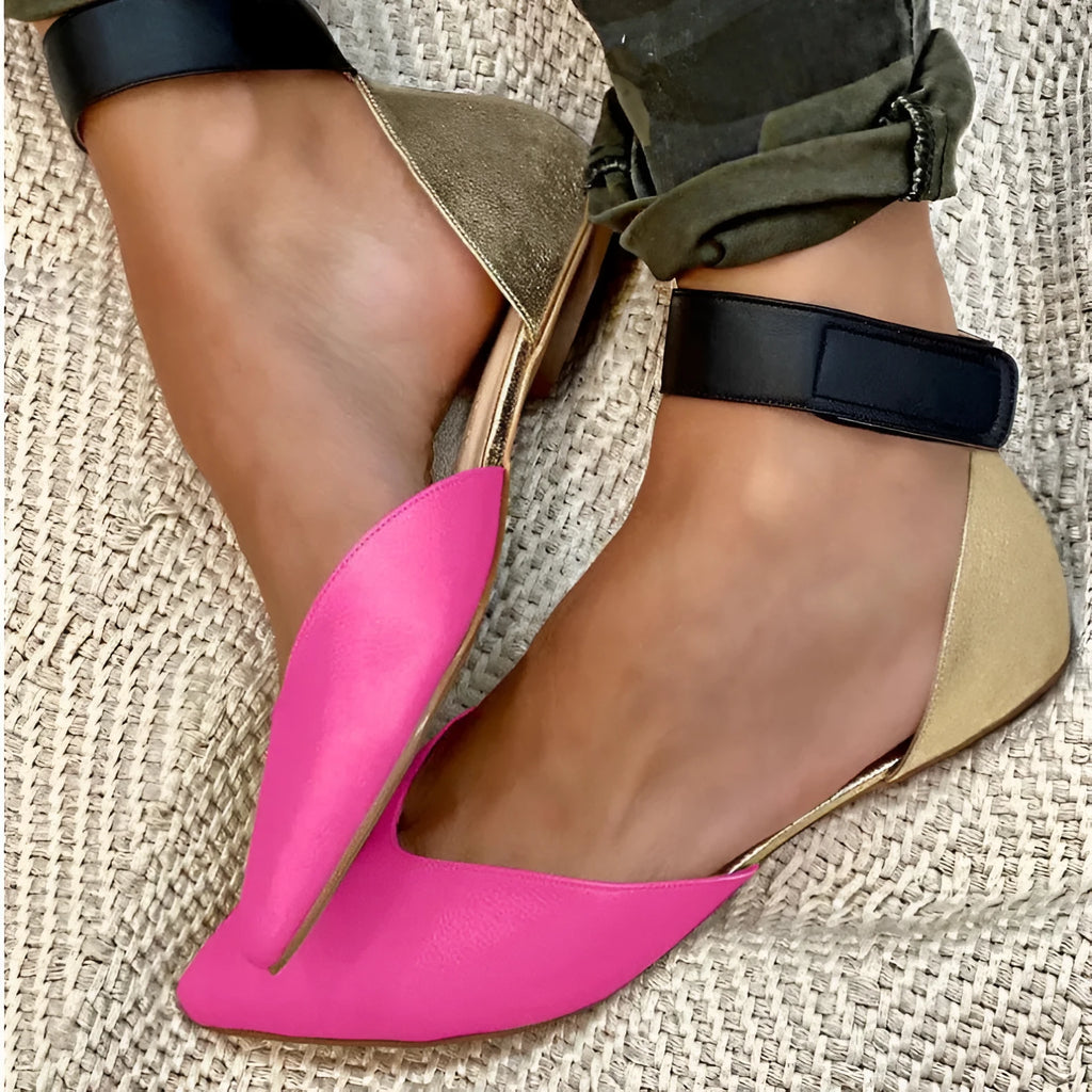 Women's beige flat sandals with a Velcro strap and hollowed PU leather upper on a white background.
