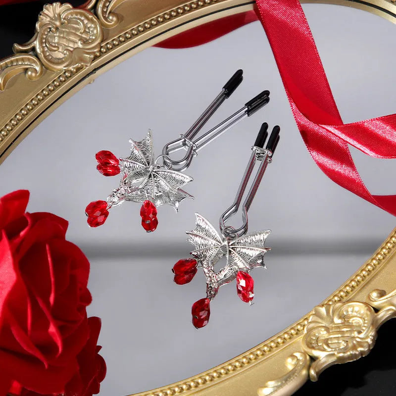 Silver alloy adjustable bat nipple clamp with screw mechanism on white background