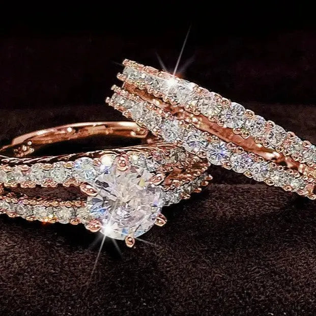 Two interchangeable geometric fashion rings with fully-jewelled round elements in gold, rose gold or silver colours
