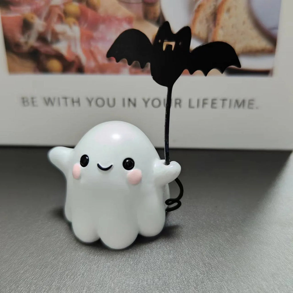 Miniature resin ghost statue walking a dog and holding a bat, Halloween decoration