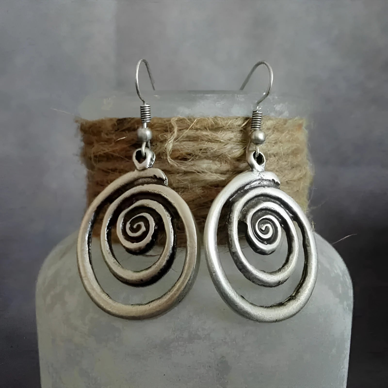 Silver geometric spiral distressed earrings with retro national style design measuring 2.6*5cm