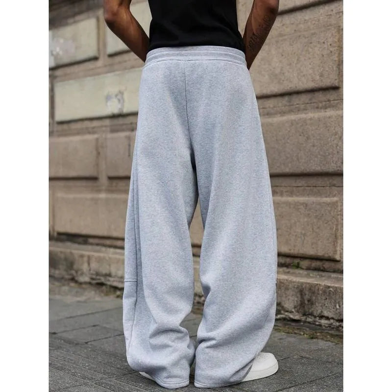 Men's high-waist straight-leg trousers in bamboo blend fabric showing cropped length and elasticated waist