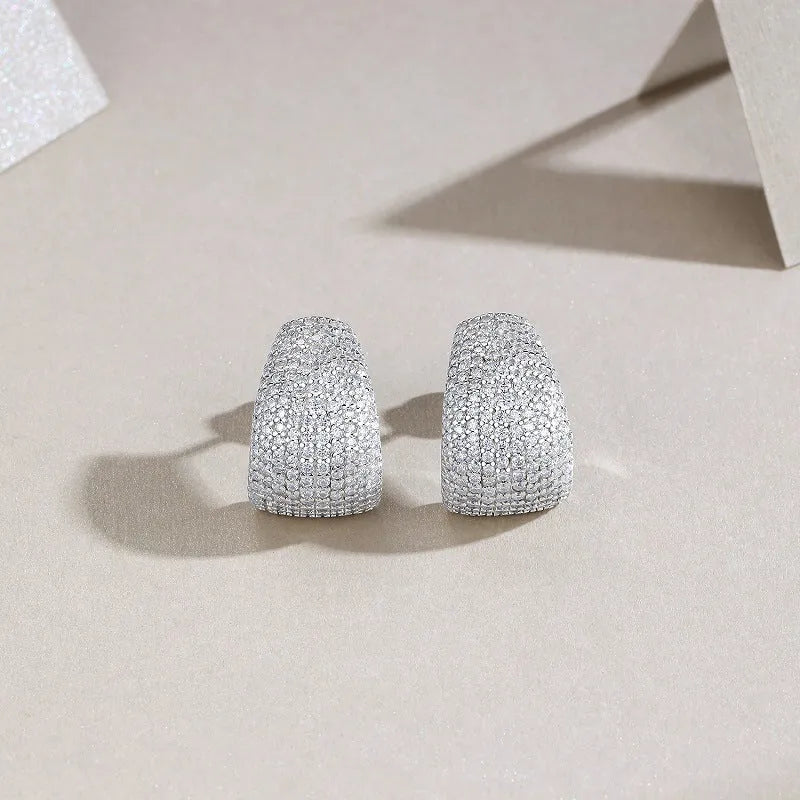 Geometric sterling silver stud earrings with moissanite stones in gift box