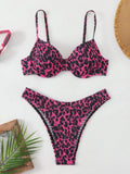 Women's leopard print bikini set with backless triangle top and briefs in brown and red colour mixes.