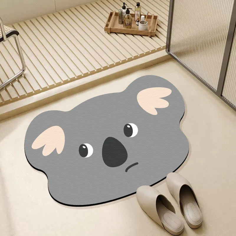 Cartoon animal diatom mud bathroom mat in Mr Brown Bear design on tiled floor.