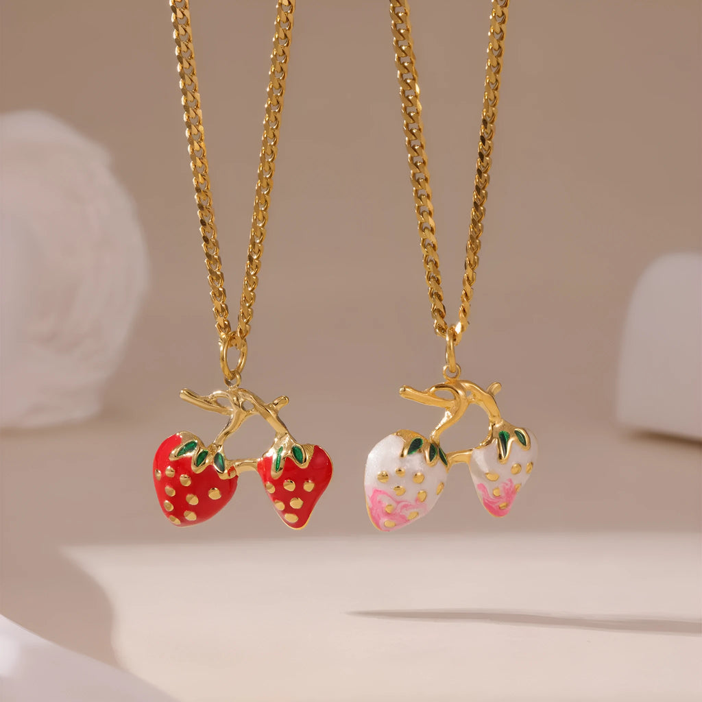 Stainless steel strawberry pendant necklace on a chain, shown in red and white gradient colour options.