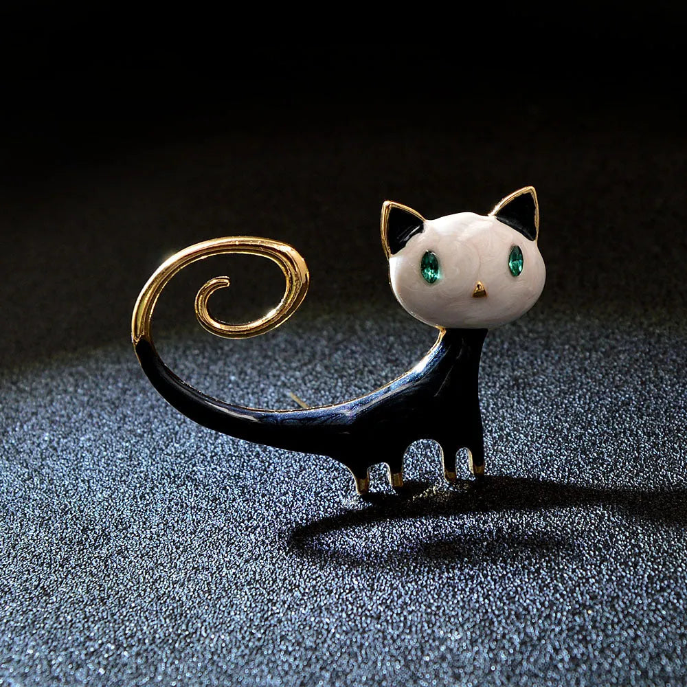 Women's alloy cat brooch with a hand-painted tail, shown in white and orange colour options.