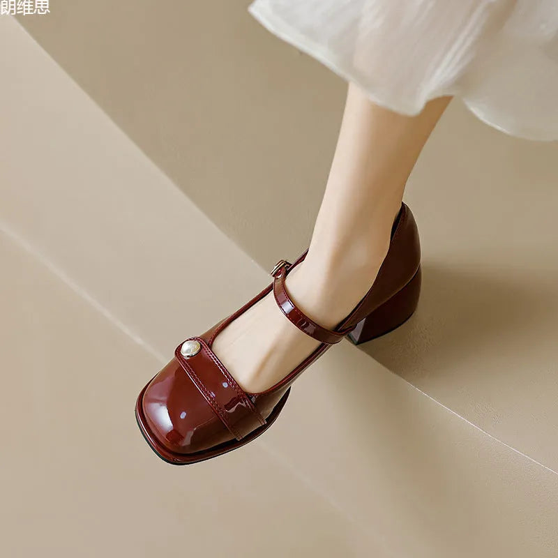 French style chunky heel ankle boots with patent leather upper, square toe, and buckle fastening