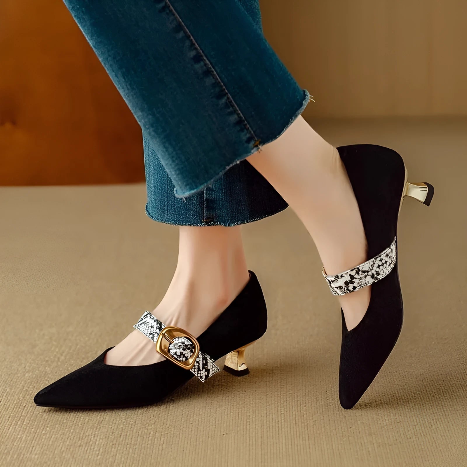 Women's black pointed high heels with stiletto heels and buckle closure