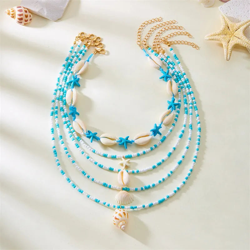 Five multi-layer women's necklaces with shell, starfish and conch beads on adjustable chains