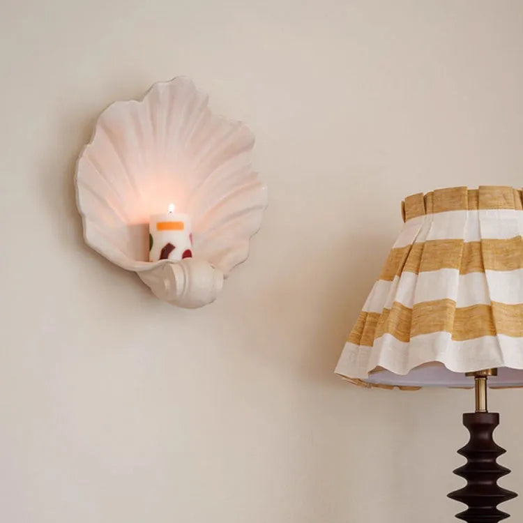 White resin simulation shell storage fruit plate ornament on a plain background.