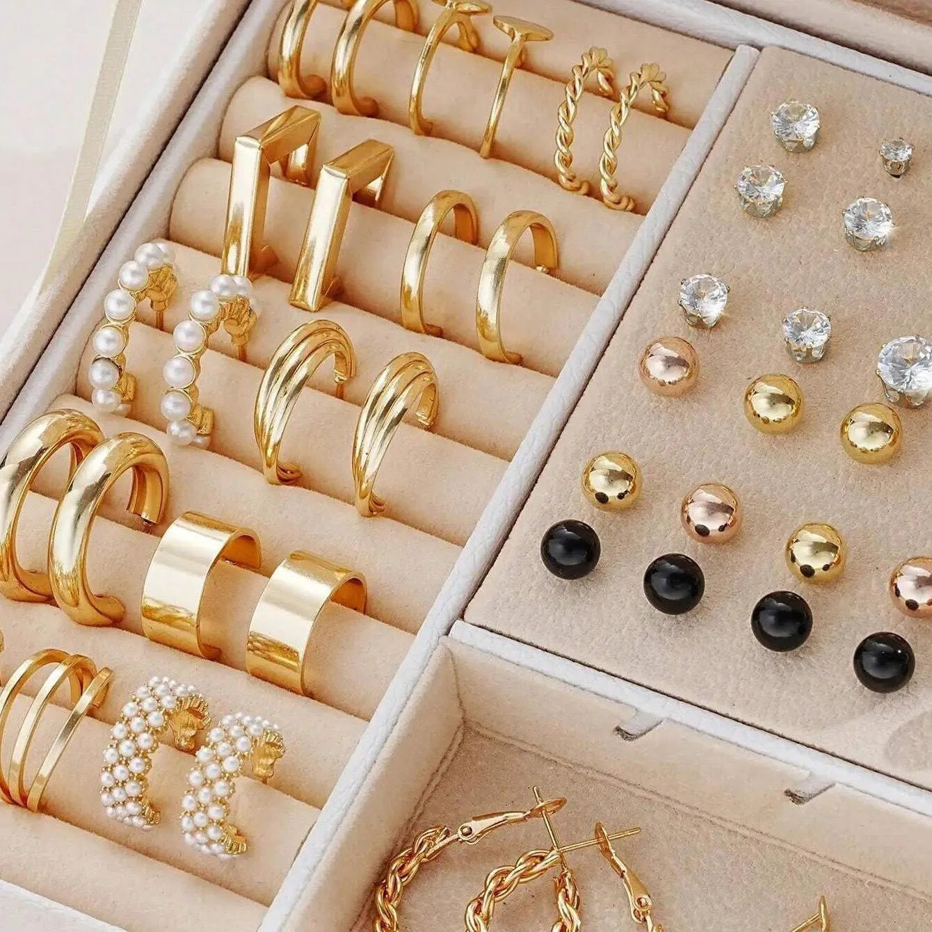 108 geometric round pearl earrings in gold and yellow electroplated alloy finishes displayed as a collection