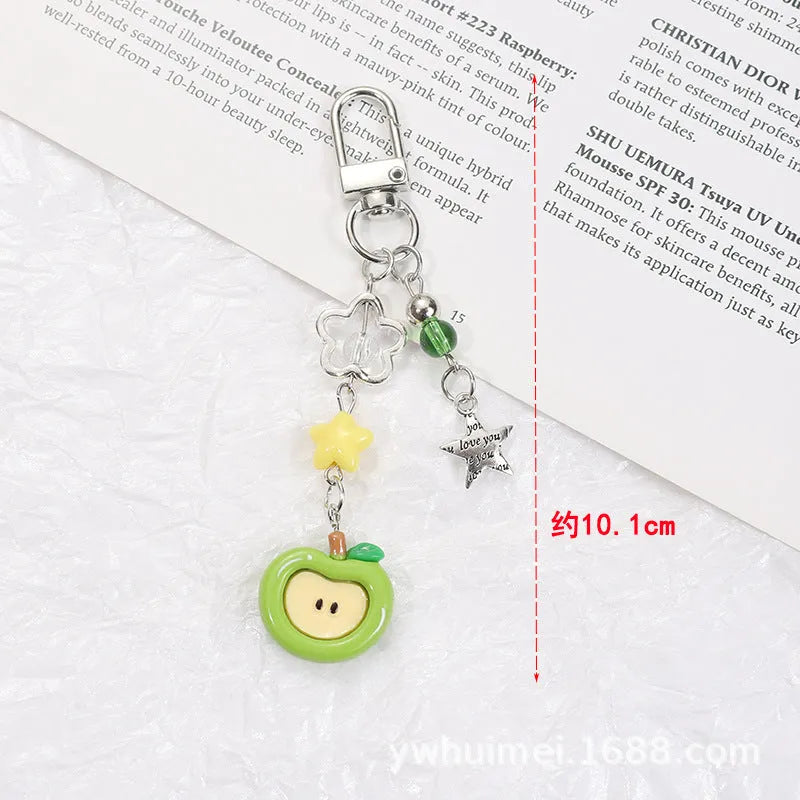 Mobile phone earphone bag pendant keychain with fruit designs including apple, strawberry, and apple core patterns