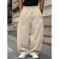 Men's high-waist straight-leg trousers in bamboo blend fabric showing cropped length and elasticated waist