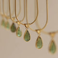 Retro blue and green water drop necklace with gem inlays on titanium steel snake bone chain