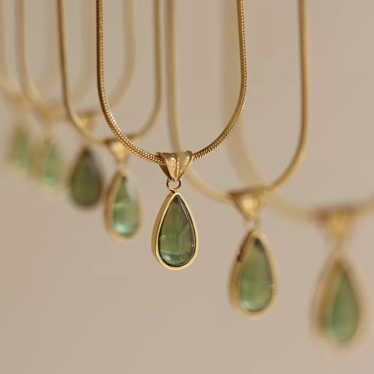 Retro blue and green water drop necklace with gem inlays on titanium steel snake bone chain