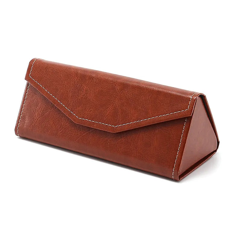 Folding glasses case in black PU cowhide with handmade stitching and triangle shape lying open