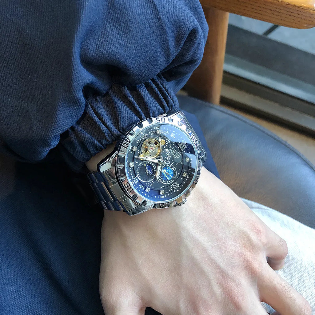 Men's silver case automatic watch with black leather strap and luminous starry dial