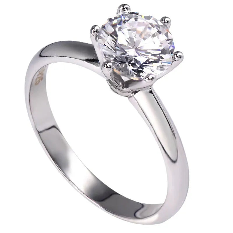White gold plated women's ring with six-claw set zircon stone in geometric design