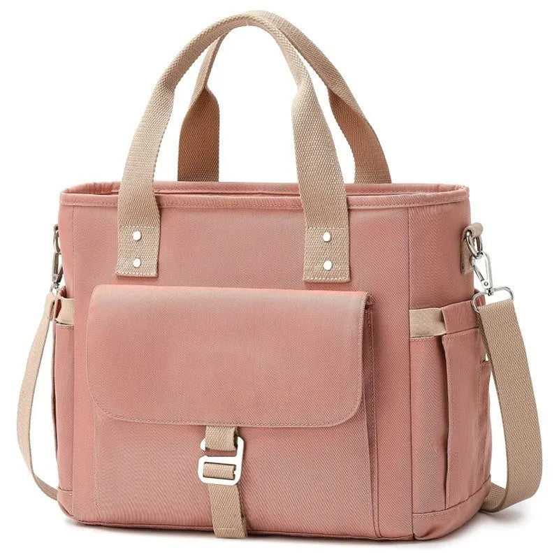 Portable cube-style picnic bag with removable shoulder strap in black, green, or pink colour options