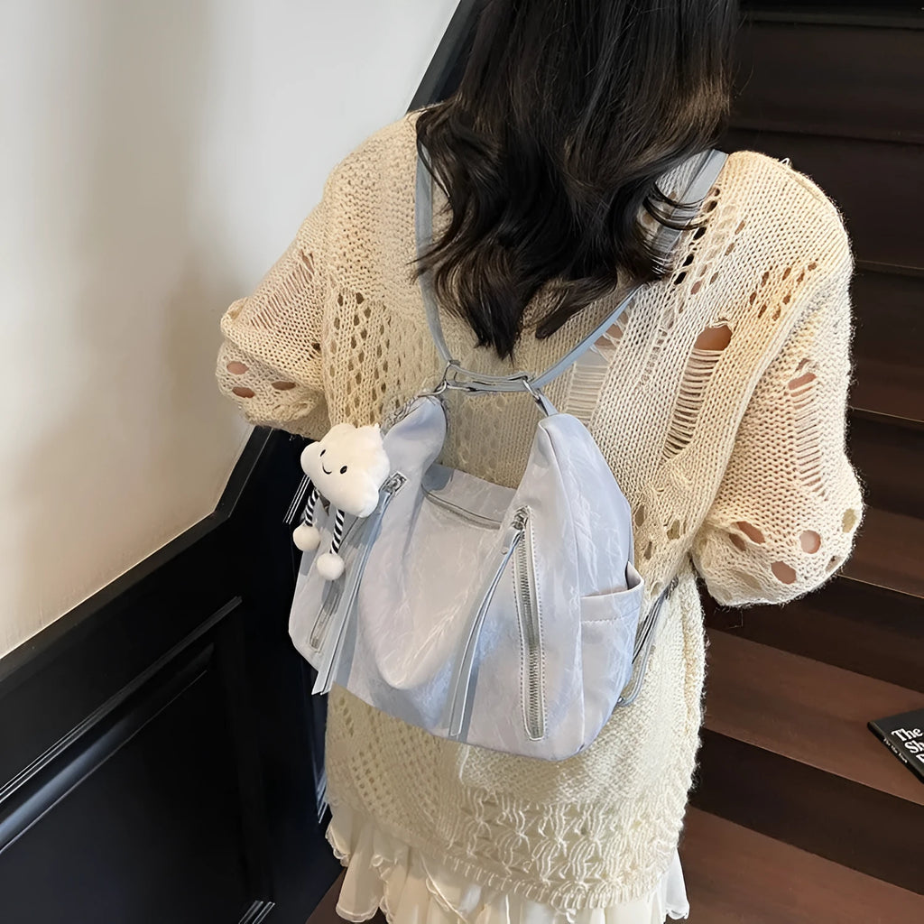 Women's soft PU backpack in four colour options with matching pendant