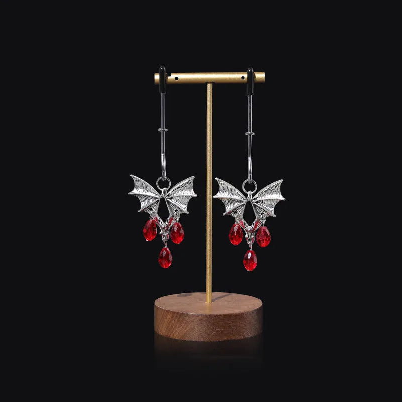 Silver alloy adjustable bat nipple clamp with screw mechanism on white background