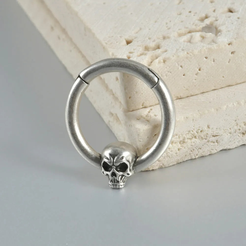 Copper punk earrings with ghost head design in ancient silver finish