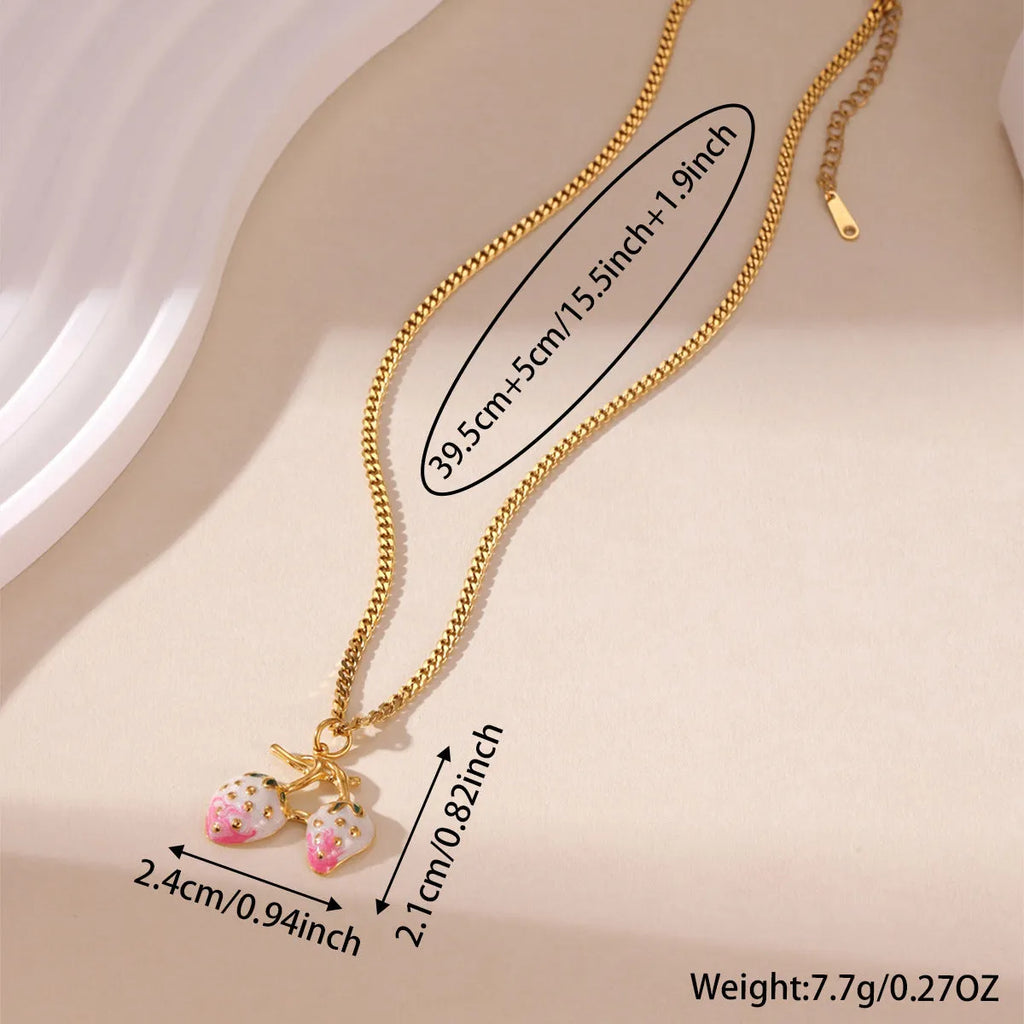 Stainless steel strawberry pendant necklace on a chain, shown in red and white gradient colour options.