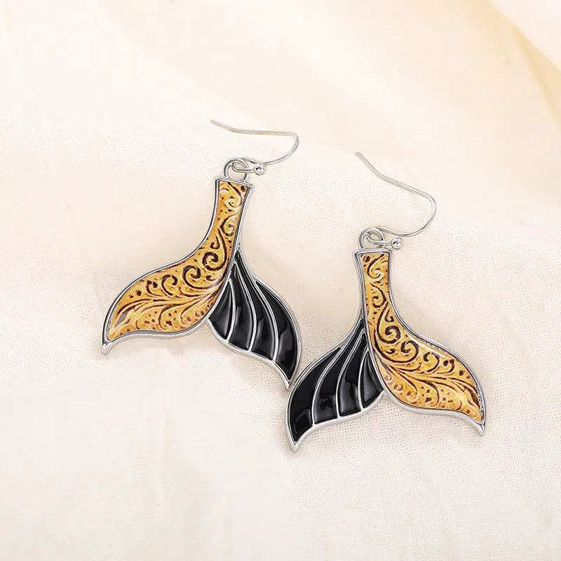 Women's fishtail earrings with whale design in white gold alloy finish