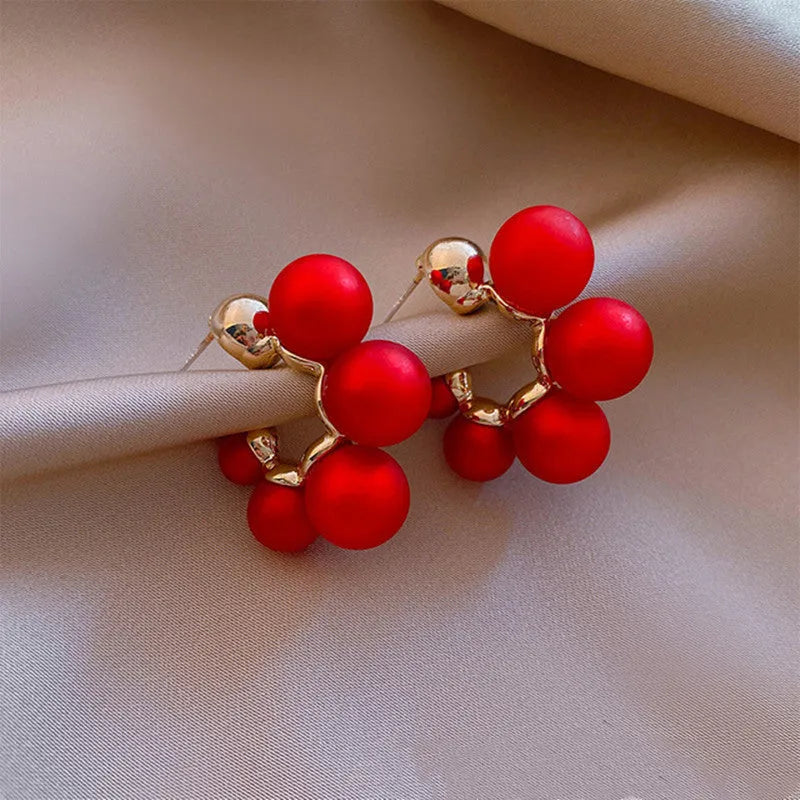 Red and white alloy bell earrings with hanging design for women