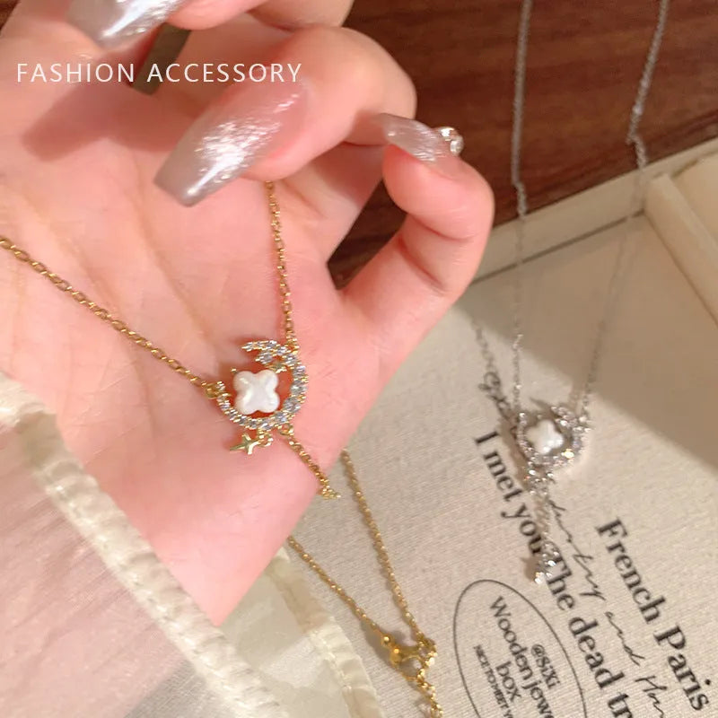 Gold star moon zirconium necklace on display with alloy pendant and adjustable chain