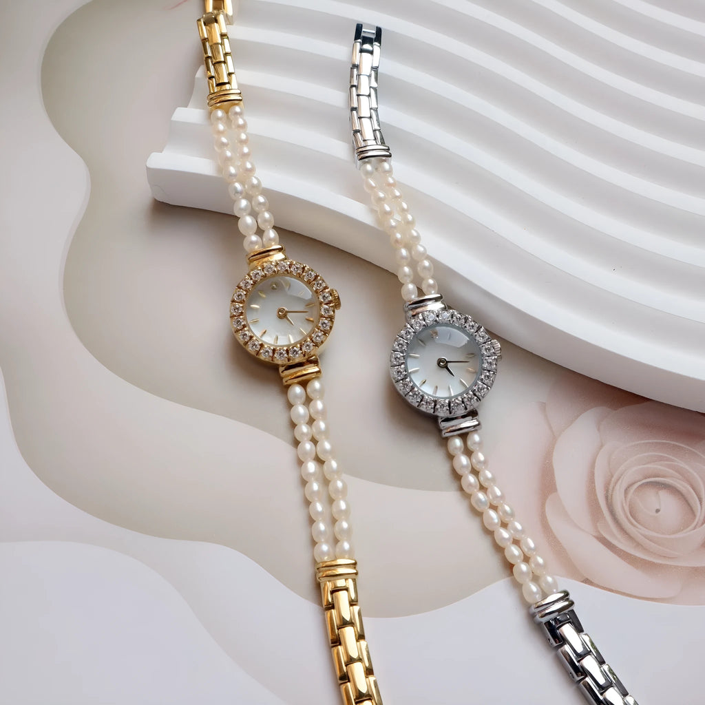 Women's light gold bracelet watch with freshwater pearl band and 18mm round dial