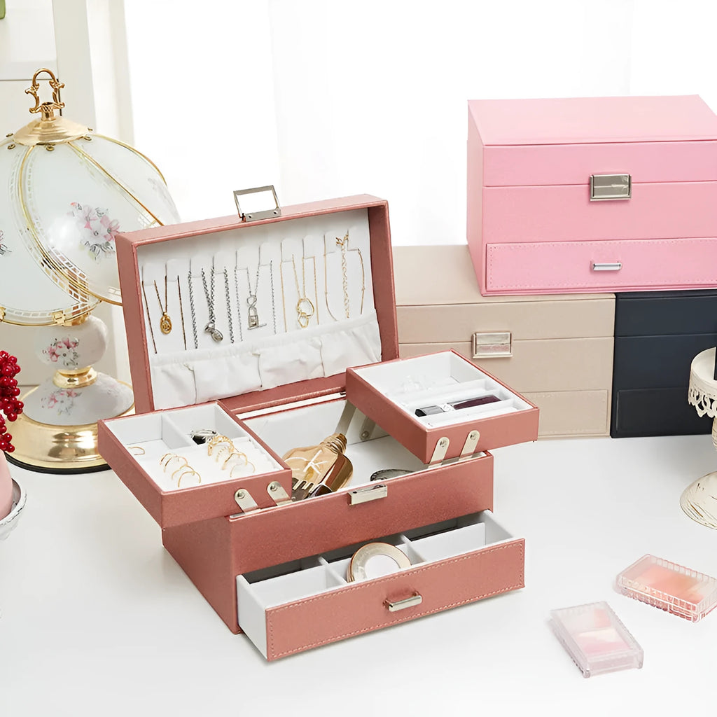 Hard case PU leather jewellery storage box in rose gold colour with dimensions 22.5cm by 15.5cm.