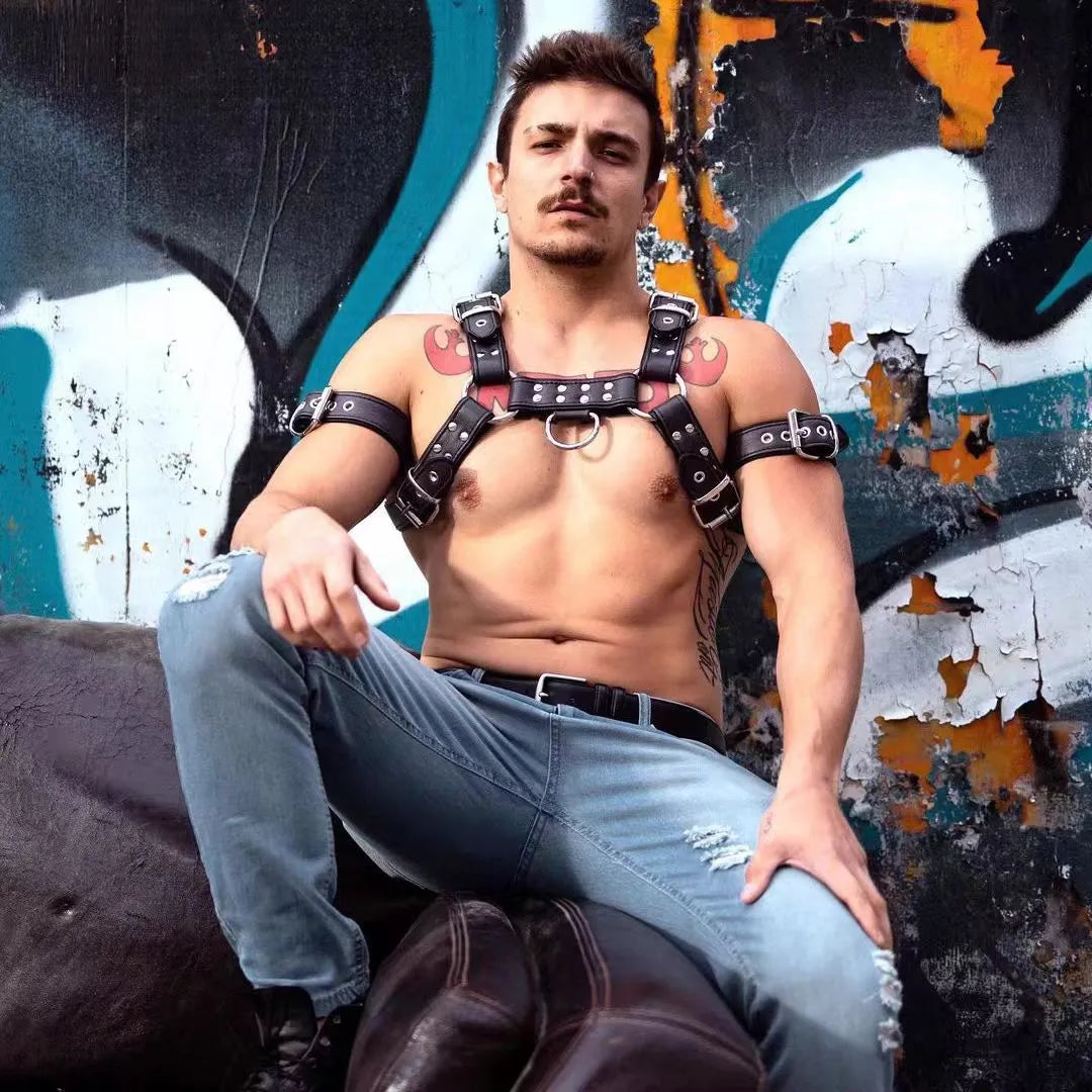 Black leather chest harness with adjustable shoulder straps and metal buckle fastenings