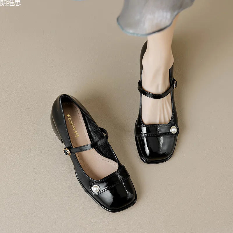 French style chunky heel ankle boots with patent leather upper, square toe, and buckle fastening