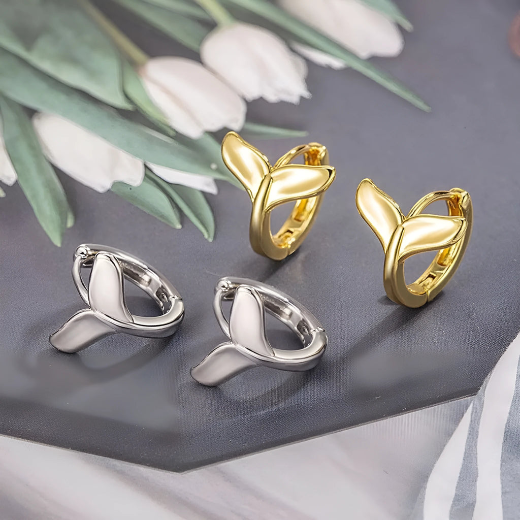 Women's fashion earrings with fishtail design in copper with gold colour finishes